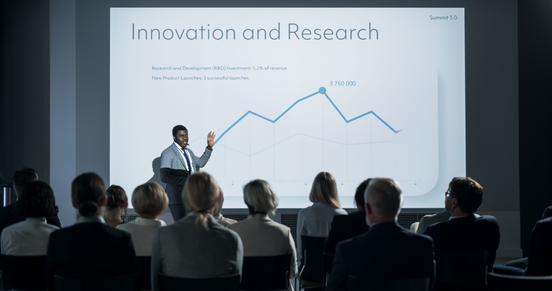 Corporate Event: Black Male Tech CEO Giving Presentation To Colleagues or Investors In the Conference Room Of Innovative Startup Office. Successful African Man Talking About Business Vision, Mission.